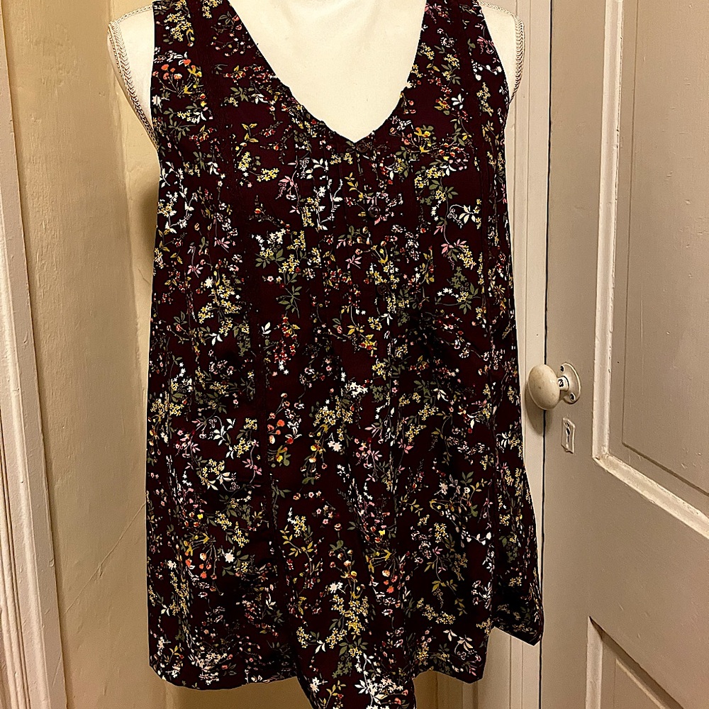 Floral, burgundy, sleeveless blouse, with solid burgundy back. Size medium.